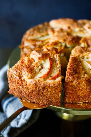 This apple cake is our favorite fall dessert! Buttery and moist with a crackly top, loaded with sweet tart apples, and a hint of cardamom.