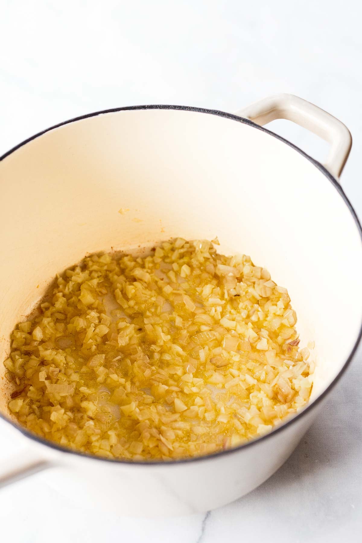 dutch oven with sautéed shallot and garlic.