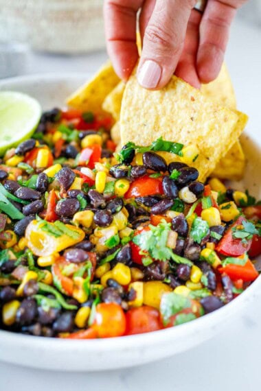 Here is my favorite black bean salsa recipe! The flavors are simple, yet punchy, and it's easy to make in under 15 minutes. Vegan and gluten-free.