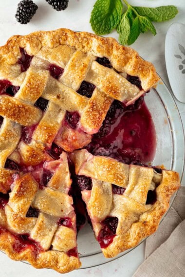 A homemade blackberry pie in a pie pan.