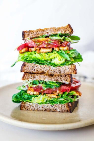 This delicious BLT sandwich features smoky tempeh bacon, ripe summer tomatoes, crisp lettuce, and toasted sourdough bread. Vegan.
