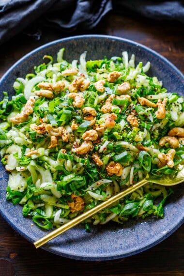 This refreshing bok choy salad is tossed in a sweet and tangy sesame ginger dressing, topped with crunchy sesame cashew brittle. Vegan and gluten-free.