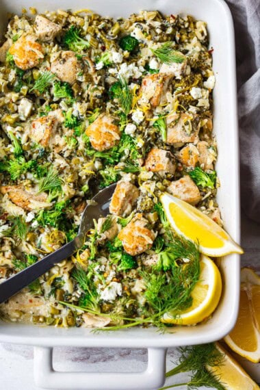Cozy one-pan Chicken Orzo Bake with broccoli, feta, and lemon is easy and delicious!  A comforting weeknight dinner, ready in under an hour! 