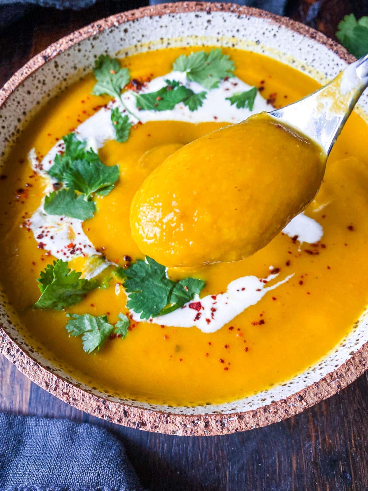 This EASY carrot soup recipe with ginger is vibrant, warming, and delicious! Made with simple ingredients in 30 mins. Vegan and GF. 