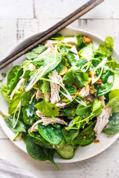 Coconut poached thai chicken salad with spinach, herbs and crunch.