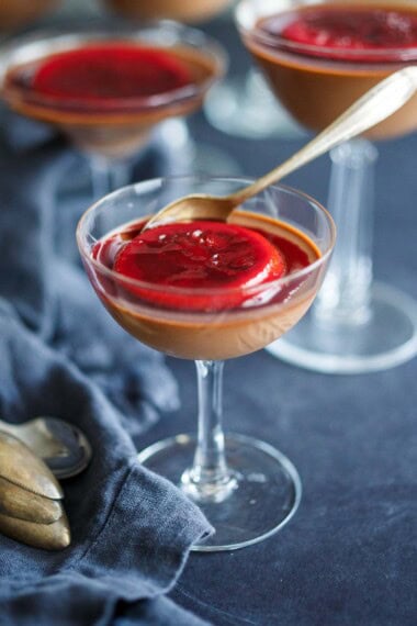 This creamy dark Chocolate Panna Cotta recipe is rich and satisfying, yet not overly sweet. Topped with a candied blood orange slice. Vegan-adaptable and can be made ahead!