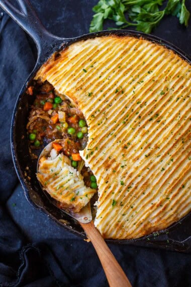 Cozy, comforting Cottage Pie made with sweet, velvety caramelized onions, veggies, ground meat, and a fluffy gruyere-potato crust. Gluten-Free.
