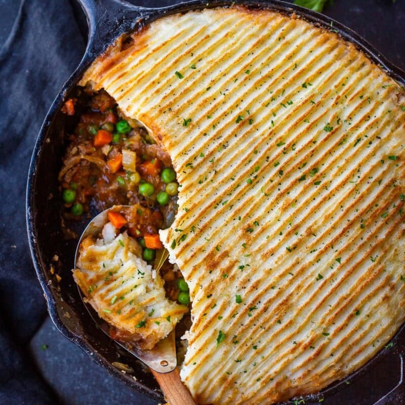 Cozy, comforting Cottage Pie made with sweet, velvety caramelized onions, veggies, ground meat, and a fluffy gruyere-potato crust. Gluten-Free.