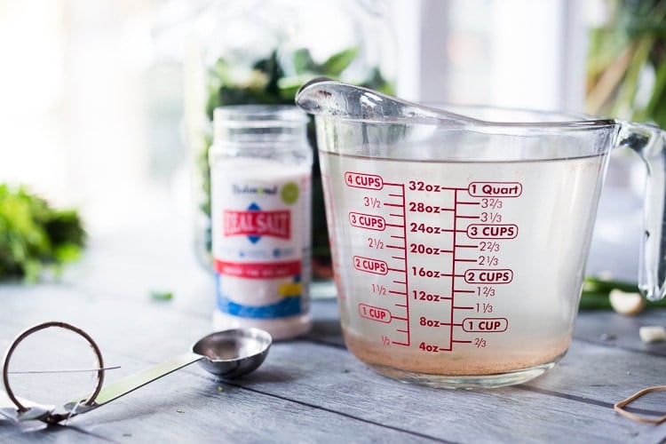 making the salt brine in a measuring cup. 