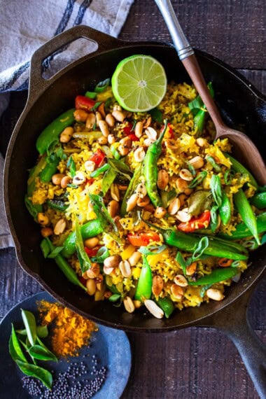 This vibrant, turmeric-spiced Indian Fried Rice is packed with colorful, nutrient-rich veggies and comes together in under 30 minutes. Vegetarian, gluten-free, and easily adaptable for a vegan diet, it's a quick, wholesome, and flavorful weeknight meal that everyone will love.