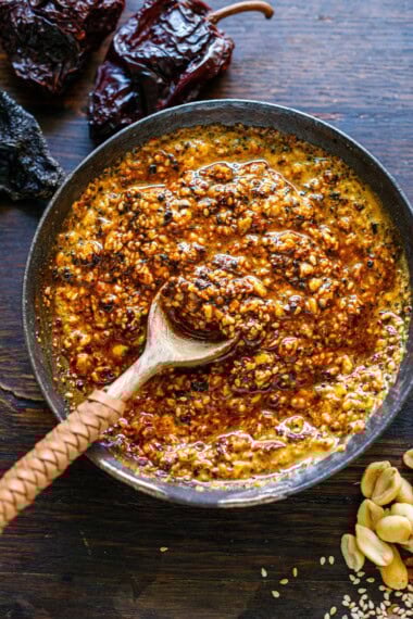 This salsa macha recipe is a delicious Mexican condiment you will fall in love with!  It's a flavorful chili oil made with crispy dried chilies, peanuts, sesame seeds, and garlic, perfect for drizzling over tacos or using as a marinade!