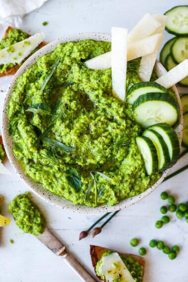 Quick and easy to make, this Spring Pea Pesto is deliciously vibrant with fresh herby flavor. &nbsp;Perfect for a dip, spread or use as a sauce with pasta and buddha bowls. &nbsp;Vegan and gluten free!
