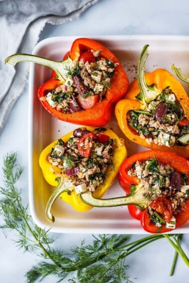 Mediterranean Stuffed Peppers in a baking dish.