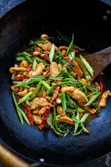 This Szechuan Chicken Stir fry is fast and flavorful! Made in under 30 minutes, with tongue tingling Szechuan (Sichuan) peppercorns, dried red chilies, thinly sliced chicken, and your choice of veggies!