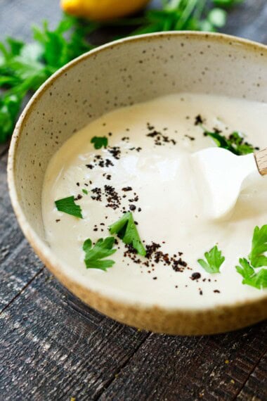 This Tahini Yogurt Sauce recipe is rich, creamy, and tangy-perfect for falafel, shawarma, cauliflower, or simply served as a dressing or dip. Vegan-adaptable.