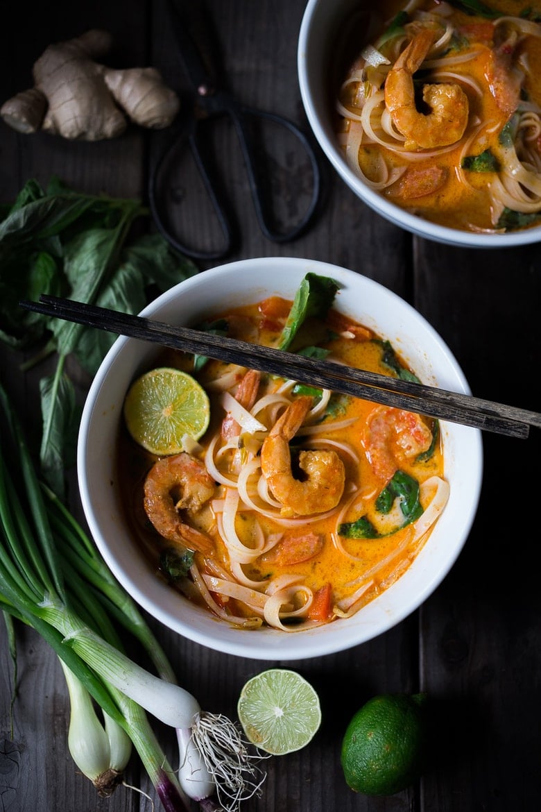 Khao soi made with shrimp- in tow serving bowls. 