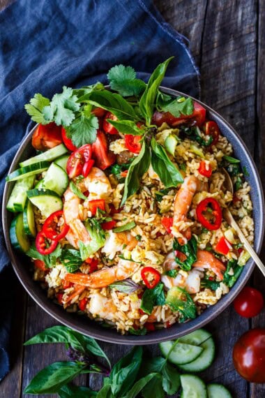 Thai Fried Rice, also known as "Khao Pad," is a flavorful and aromatic dish made with jasmine rice, tender shrimp, veggies, and a savory stir-fry sauce.
