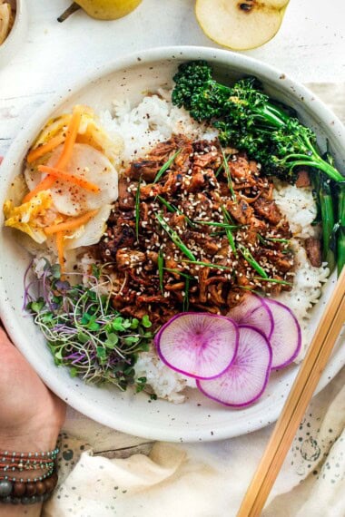 Delicious plant-based, Korean Bulgogi Bowl, ready in minutes! Jackfruit soaks up all the yummy flavors instantly without hours of marinating. Pair with rice, kimchi, and a seared vegetable for a quick and amazing Vegan Bulgogi Bowl! 
