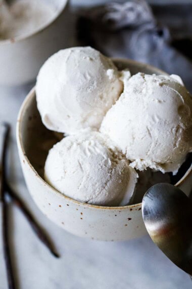 This dairy-free ice cream recipe is so creamy and luscious! It's way better than store-bought and incredibly easy to make using coconut milk. Use it as a jumping-off point for your own creations. Vegan and Gluten-free.