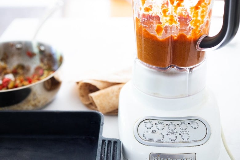 making enchilada sauce in a blender. 